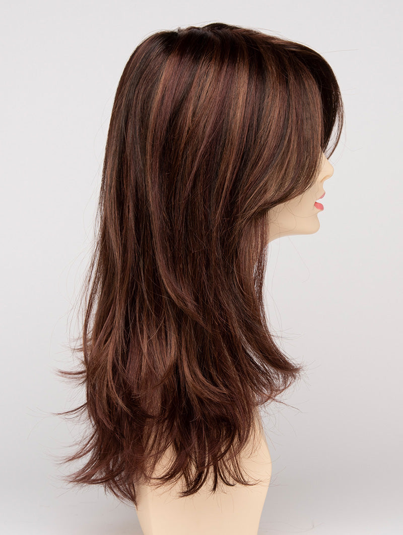 profile side of a long Kinner Beauty Wigs wig for woman on mannequin head 