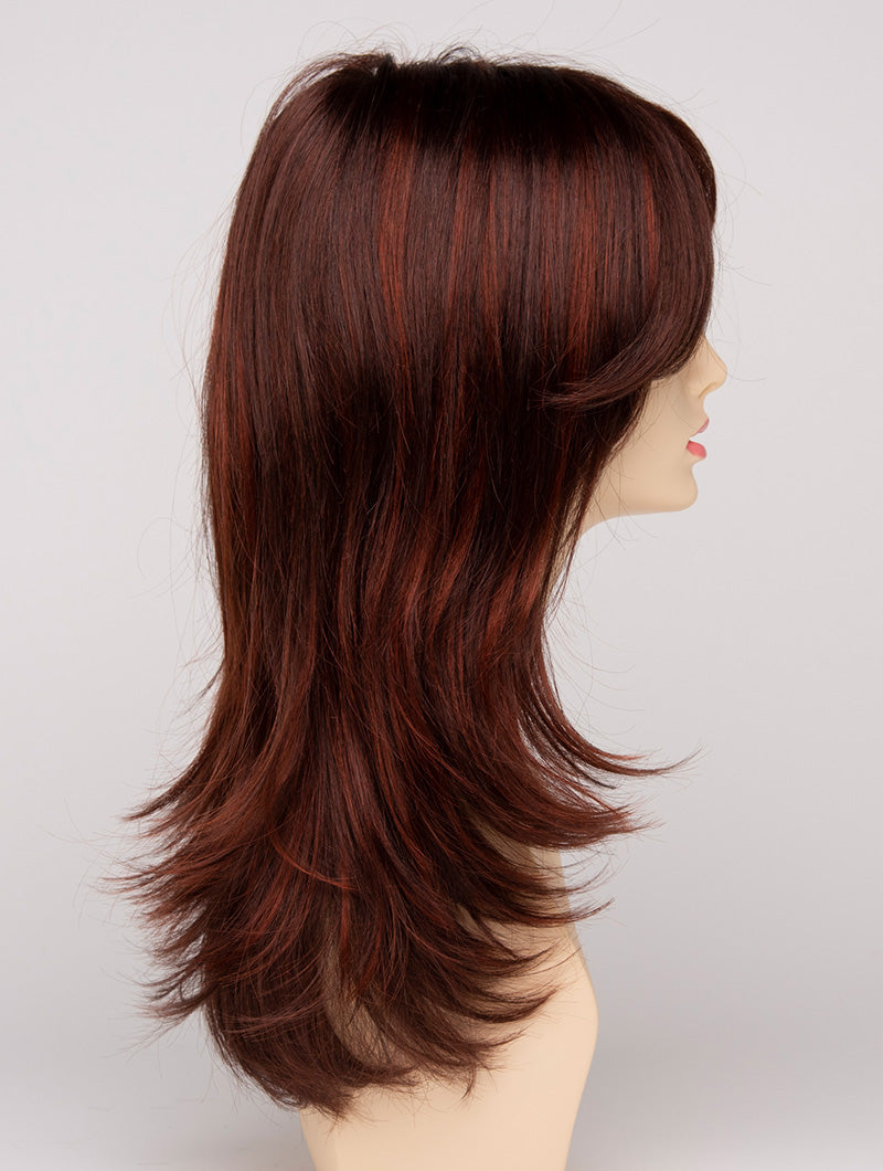 profile side of a long Kinner Beauty Wigs wig for woman on mannequin head 