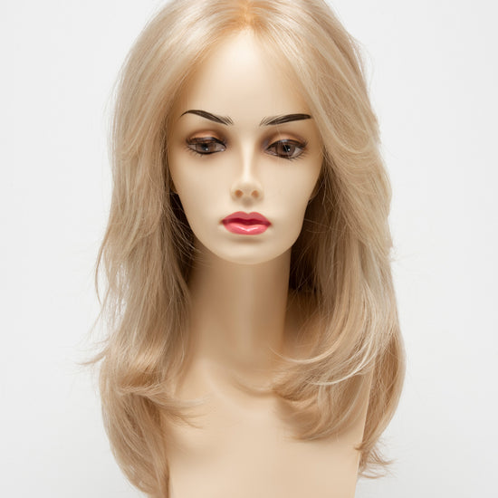 front side of a long Kinner Beauty Wigs wig for woman on mannequin head 