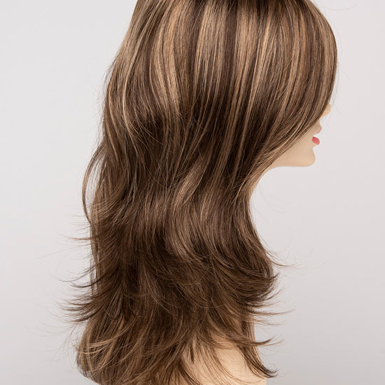 profile side of a long Kinner Beauty Wigs wig for woman on mannequin head 