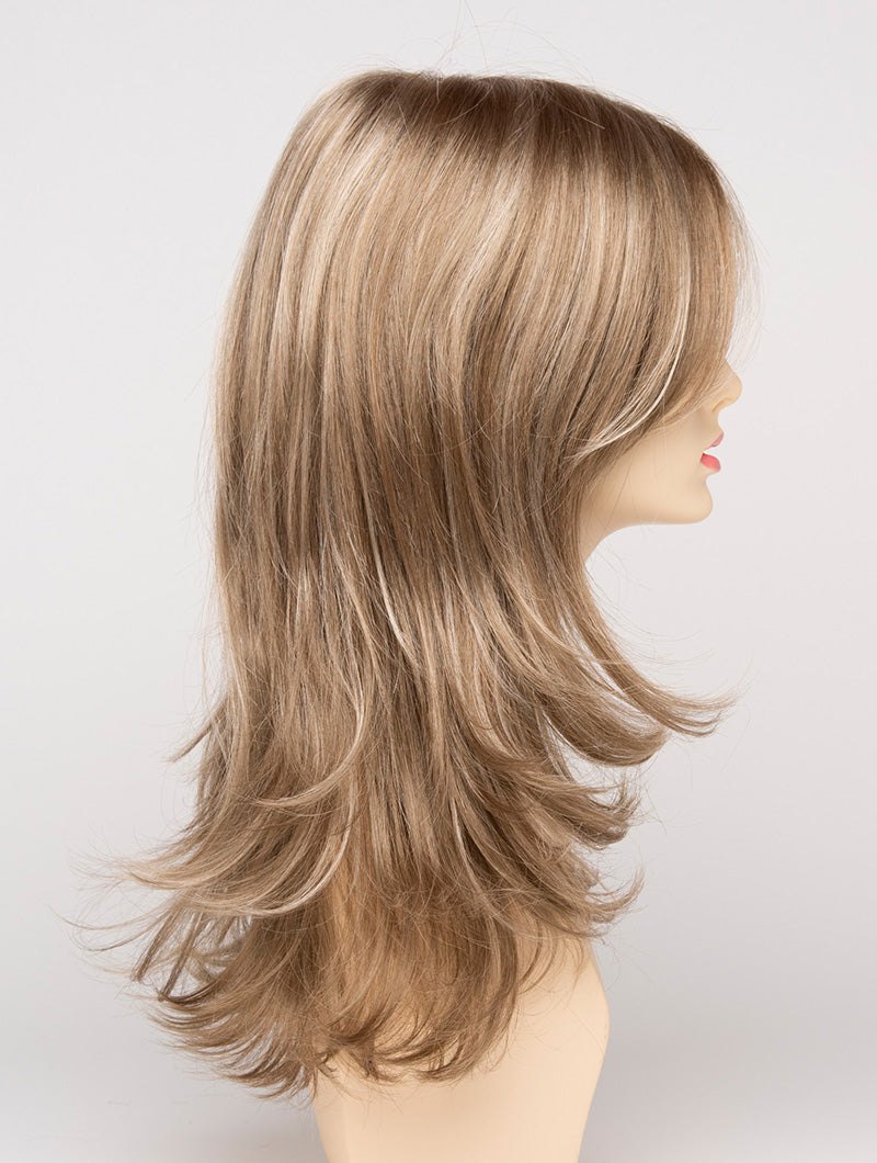 profile side of a long Kinner Beauty Wigs wig for woman on mannequin head 