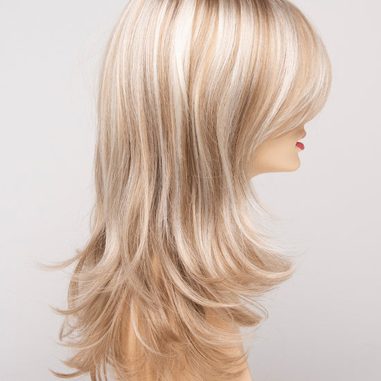 profile side of a long Kinner Beauty Wigs wig for woman on mannequin head 