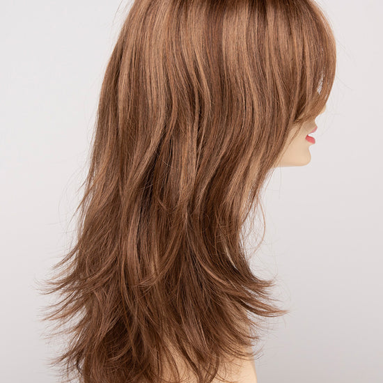 profile side of a long Kinner Beauty Wigs wig for woman on mannequin head 