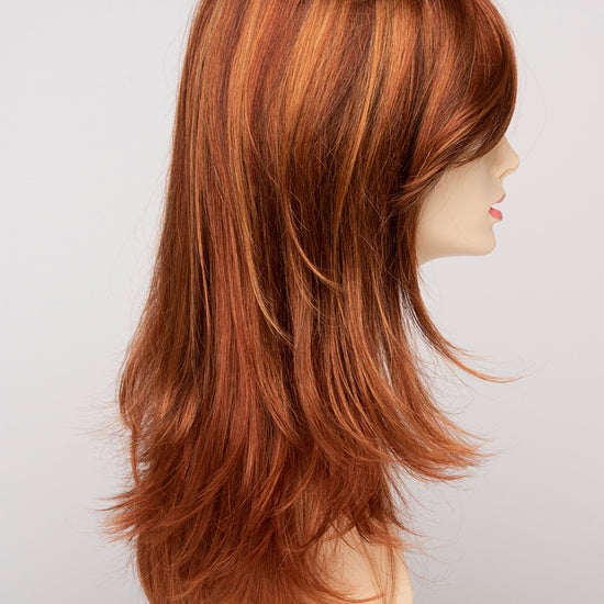 profile side of a long Kinner Beauty Wigs wig for woman on mannequin head 