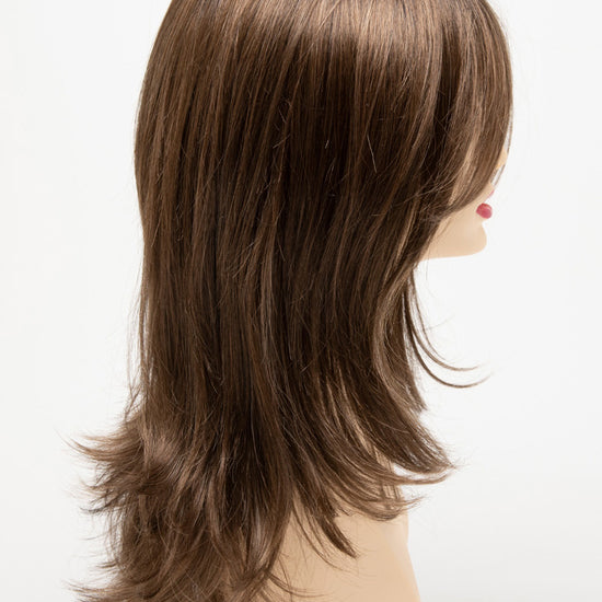 profile side of a long Kinner Beauty Wigs wig for woman on mannequin head 