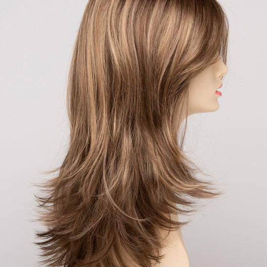 profile side of a long Kinner Beauty Wigs wig for woman on mannequin head 