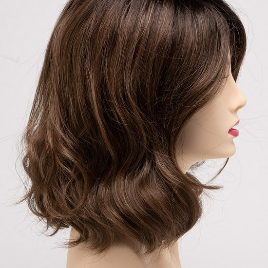 profile side of a medium Kinner Beauty Wigs wig for woman on mannequin head 