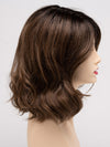 profile side of a medium Kinner Beauty Wigs wig for woman on mannequin head 