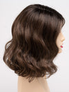 profile side of a medium Kinner Beauty Wigs wig for woman on mannequin head 