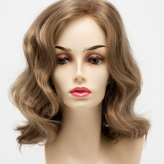 front side of a medium Kinner Beauty Wigs wig for woman on mannequin head 