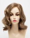 front side of a medium Kinner Beauty Wigs wig for woman on mannequin head 