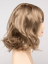 profile side of a medium Kinner Beauty Wigs wig for woman on mannequin head 