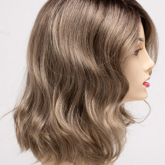 profile side of a medium Kinner Beauty Wigs wig for woman on mannequin head 