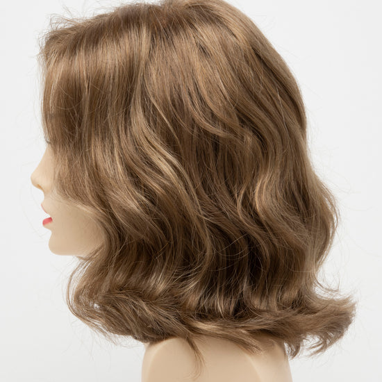 profile side of a medium Kinner Beauty Wigs wig for woman on mannequin head 