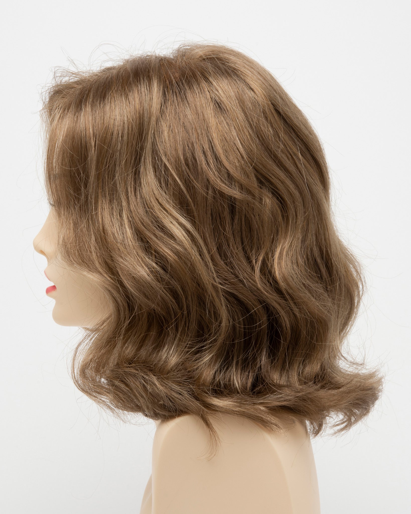 profile side of a medium Kinner Beauty Wigs wig for woman on mannequin head 