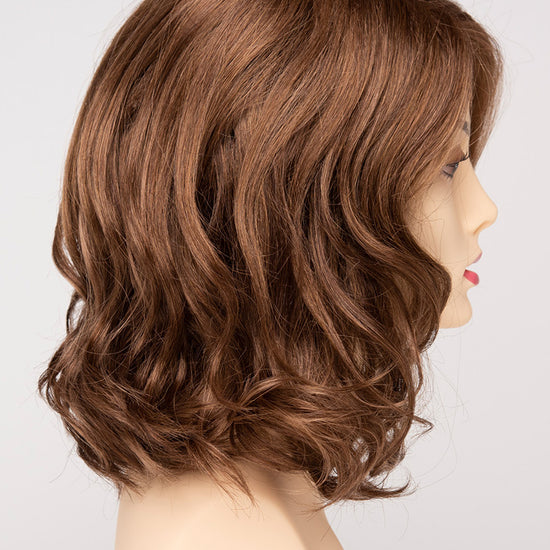 profile side of a medium Kinner Beauty Wigs wig for woman on mannequin head 