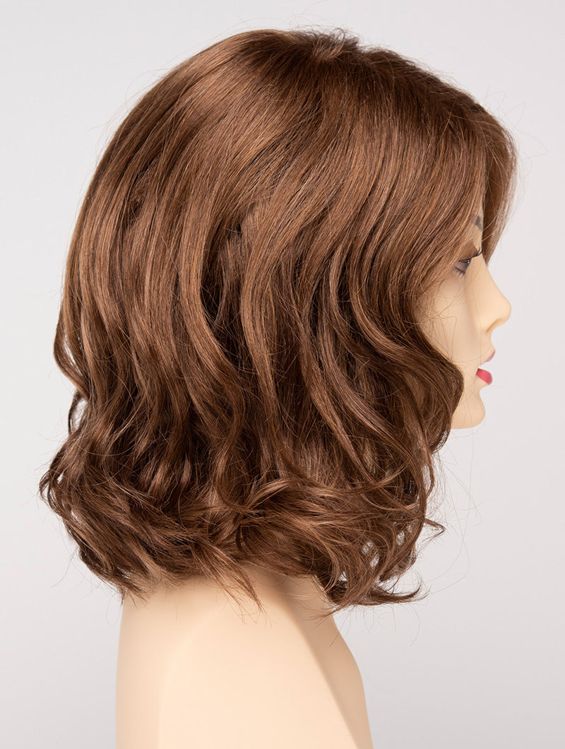 profile side of a medium Kinner Beauty Wigs wig for woman on mannequin head 