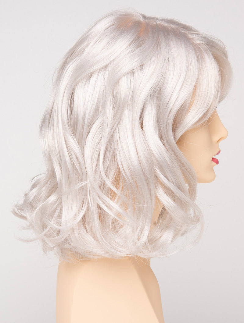 profile side of a medium Kinner Beauty Wigs wig for woman on mannequin head 