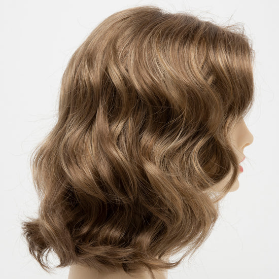 profile side of a medium Kinner Beauty Wigs wig for woman on mannequin head 