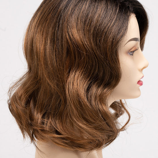 profile side of a medium Kinner Beauty Wigs wig for woman on mannequin head 