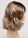 profile side of a medium Kinner Beauty Wigs wig for woman on mannequin head 