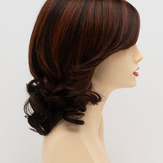 profile side of a medium Kinner Beauty Wigs wig for woman on mannequin head 