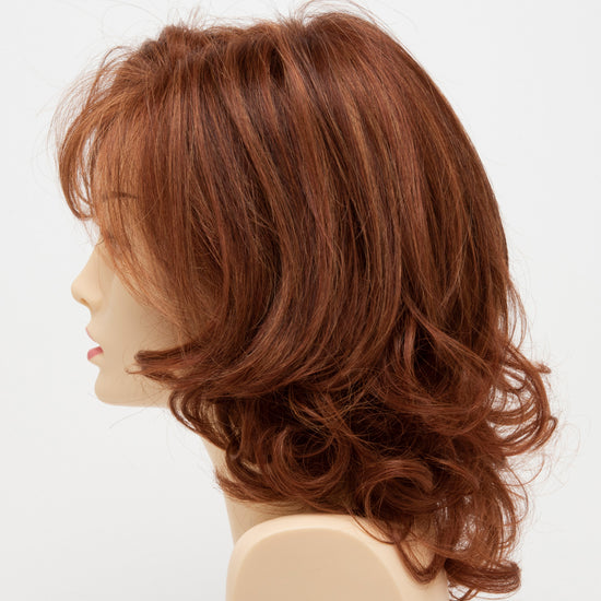 profile side of a medium Kinner Beauty Wigs wig for woman on mannequin head 