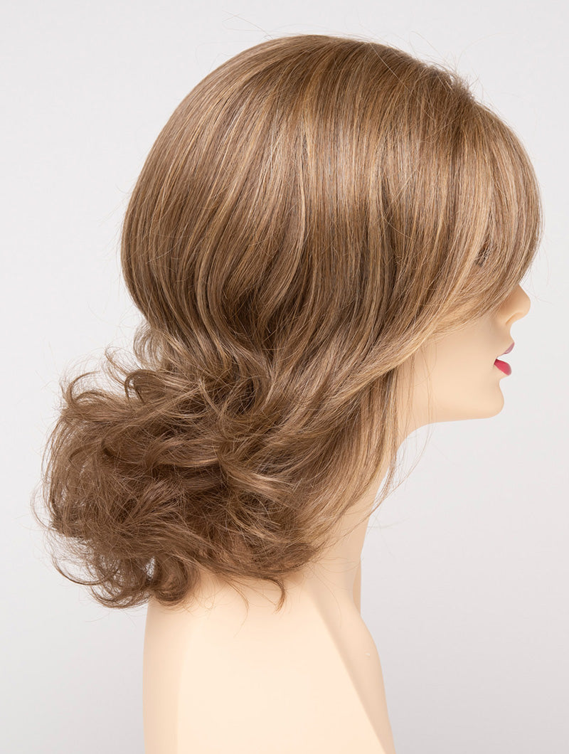 profile side of a medium Kinner Beauty Wigs wig for woman on mannequin head 