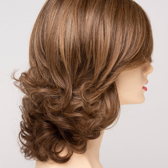 profile side of a medium Kinner Beauty Wigs wig for woman on mannequin head 