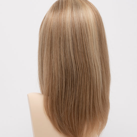 back side of a medium Kinner Beauty Wigs wig for woman on mannequin head 