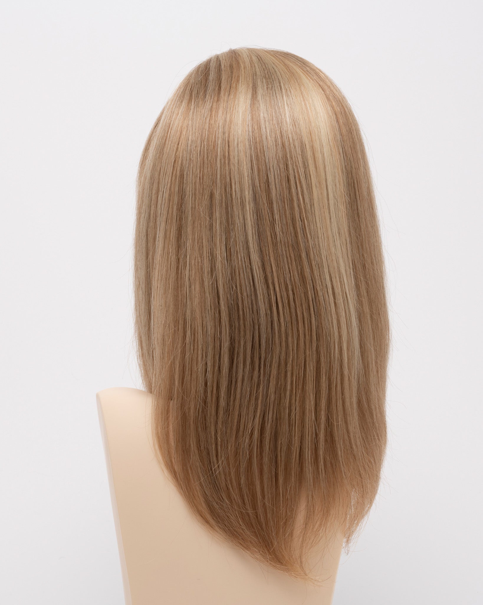 back side of a medium Kinner Beauty Wigs wig for woman on mannequin head 