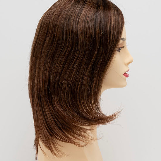 profile side of a medium Kinner Beauty Wigs wig for woman on mannequin head 