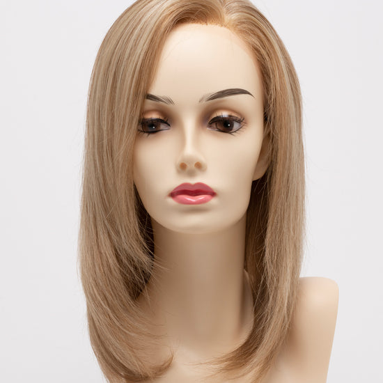 front side of a medium Kinner Beauty Wigs wig for woman on mannequin head 