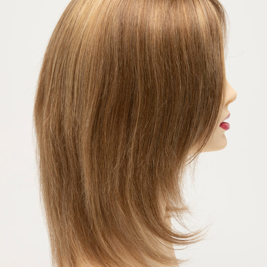 profile side of a medium Kinner Beauty Wigs wig for woman on mannequin head 