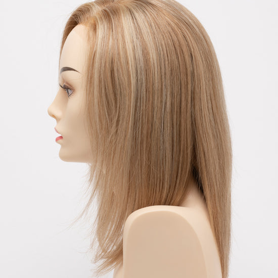 profile side of a medium Kinner Beauty Wigs wig for woman on mannequin head 