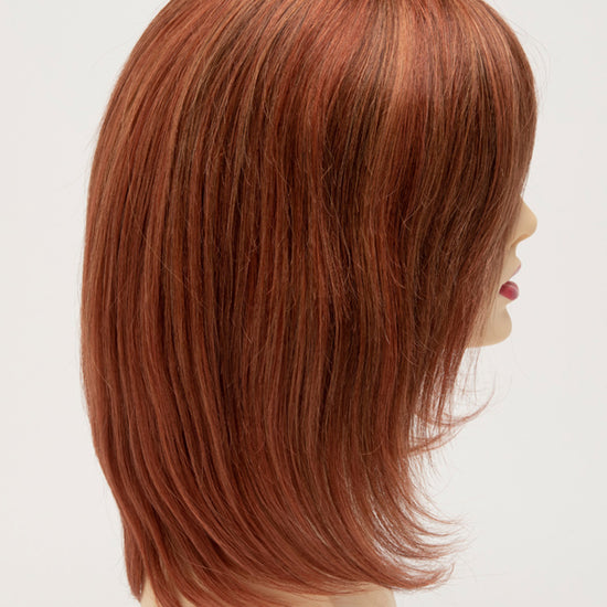 profile side of a medium Kinner Beauty Wigs wig for woman on mannequin head 