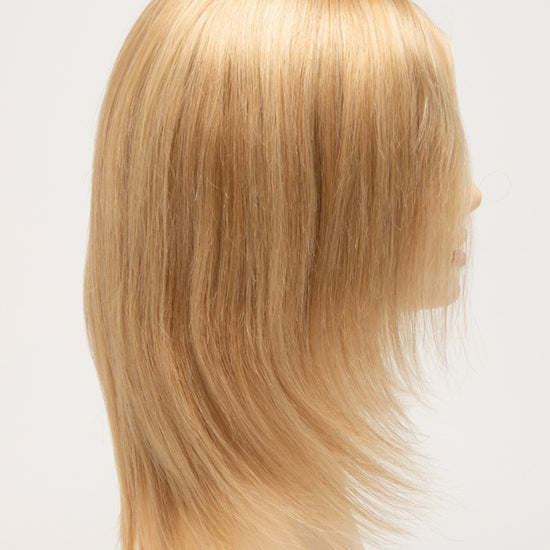 profile side of a medium Kinner Beauty Wigs wig for woman on mannequin head 