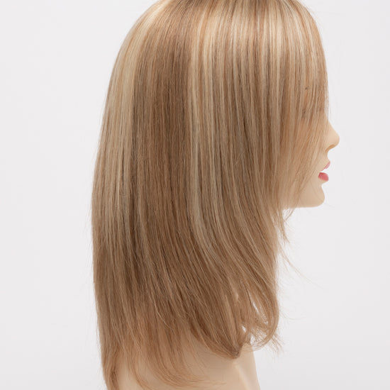 profile side of a medium Kinner Beauty Wigs wig for woman on mannequin head 