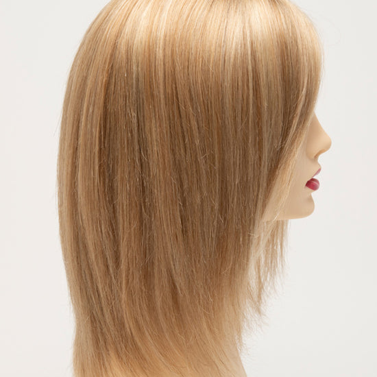 profile side of a medium Kinner Beauty Wigs wig for woman on mannequin head 