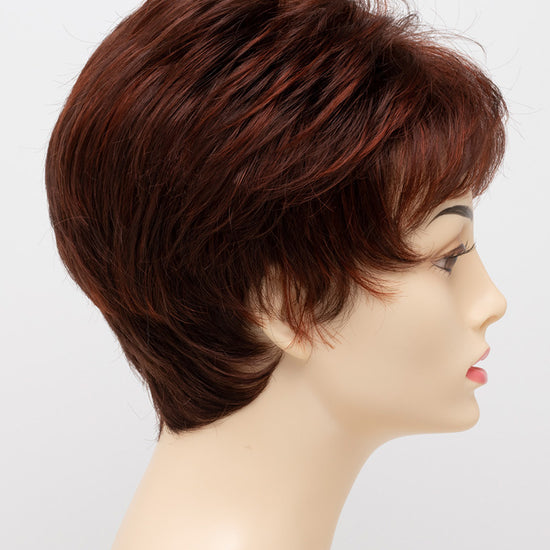 profile side of a short Kinner Beauty Wigs wig on woman head 