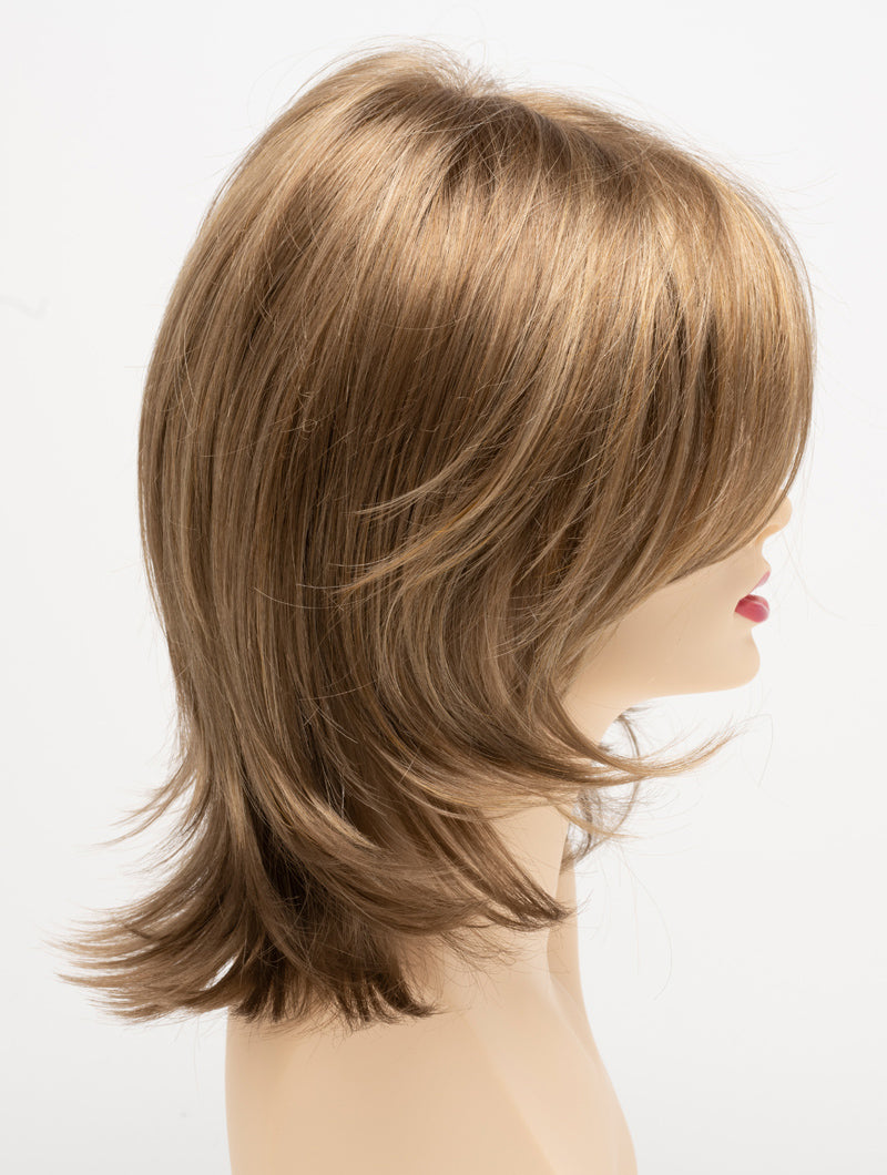 profile side of a medium Kinner Beauty Wigs wig for woman on mannequin head 