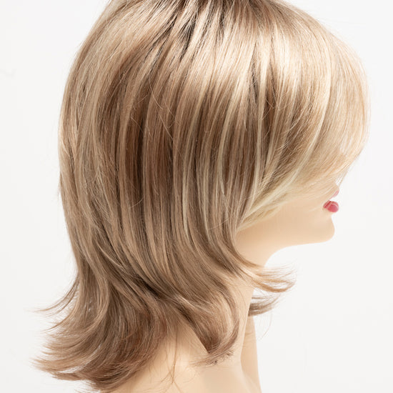 profile side of a medium Kinner Beauty Wigs wig for woman on mannequin head 