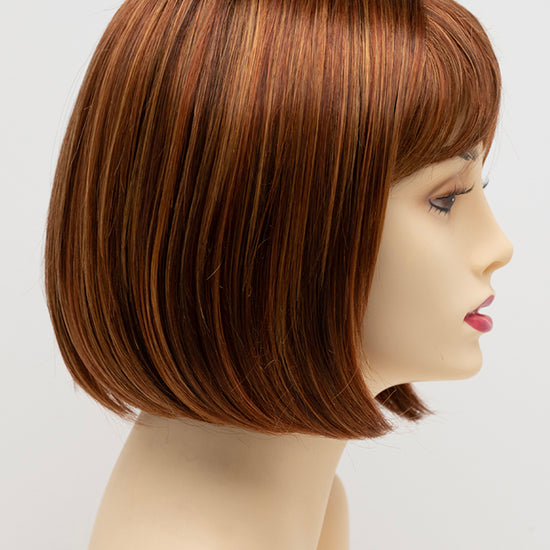 profile side of a short Kinner Beauty Wigs wig on woman head 