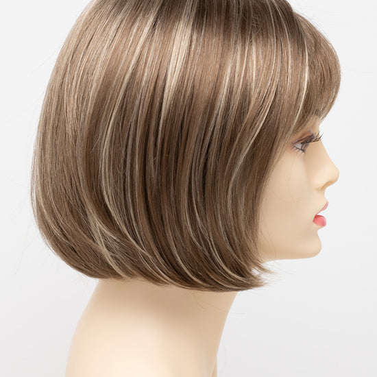 profile side of a short Kinner Beauty Wigs wig on woman head 