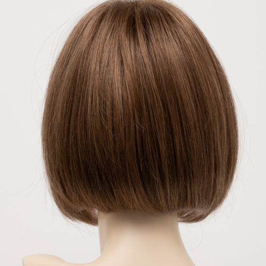 back side of a short wig Kinner Beauty Wigs for woman on mannequin head 