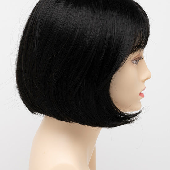 profile side of a short Kinner Beauty Wigs wig on woman head 