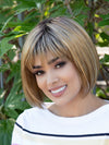 front side of a short Kinner Beauty Wigs wig on woman head 