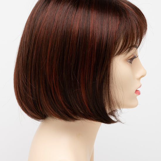 profile side of a short Kinner Beauty Wigs wig on woman head 