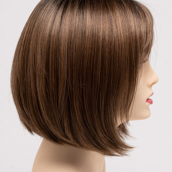 profile side of a short Kinner Beauty Wigs wig on woman head 