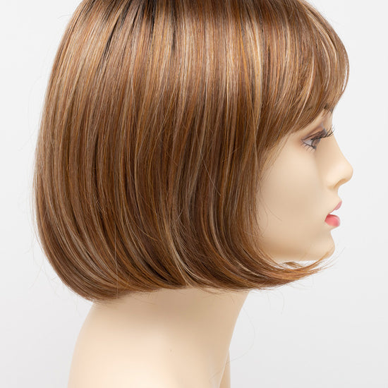 profile side of a short Kinner Beauty Wigs wig on woman head 